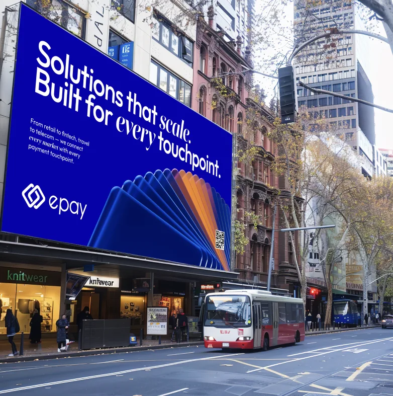 Street billboard: “Solutions that scale. Built for every touchpoint.”