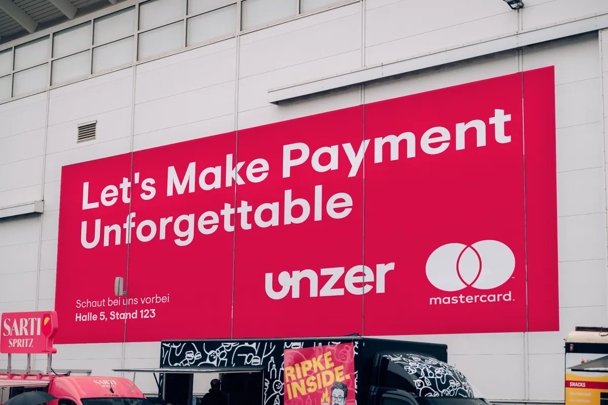 Concept: a facade banner on the hall, “Let’s Make Payment Unforgettable.”